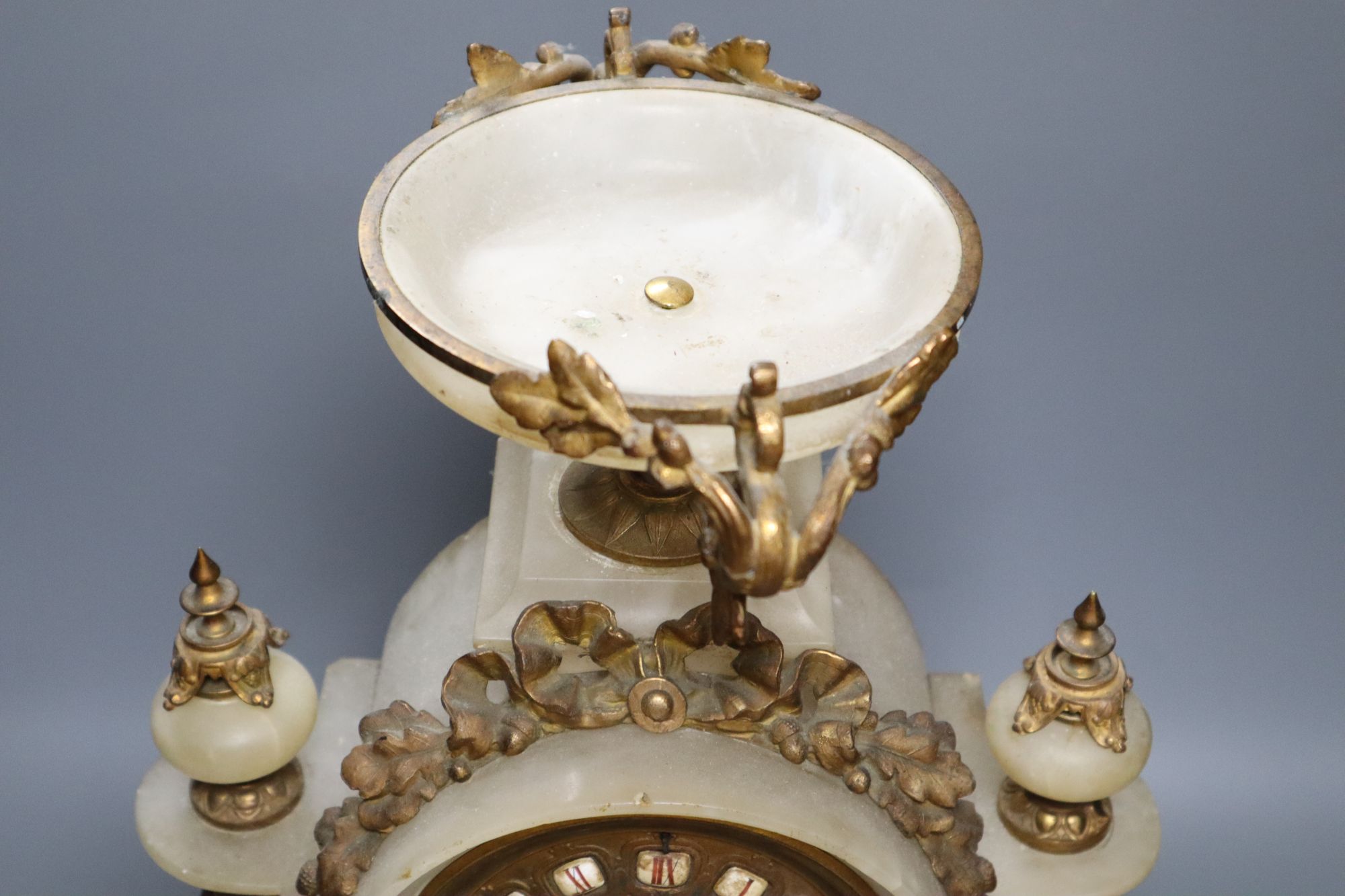 A French gilt metal and alabaster mantel clock, height 49cm